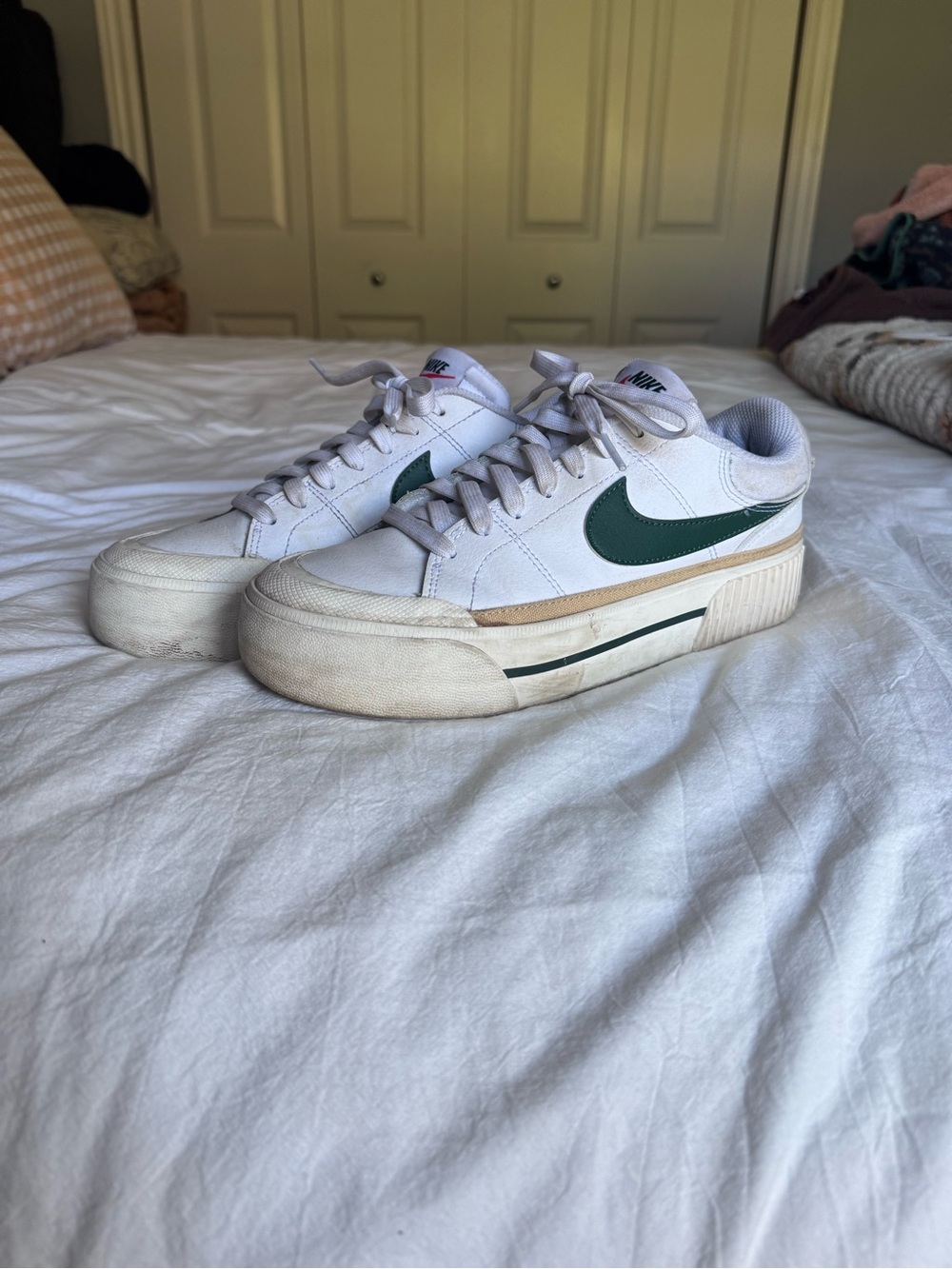 Nike Women’s White Platform Sneakers with Green Swoosh